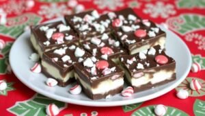 Cottage Cheese Chocolate Peppermint Bark Bars on a festive table, topped with crushed peppermint.